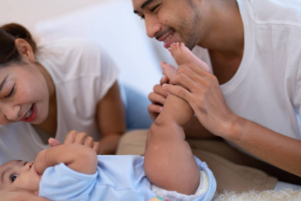 A father and mother bonding with their baby