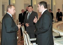 A picture showing Vladimir Putin 31 May 2001 welcoming some Oligarchs